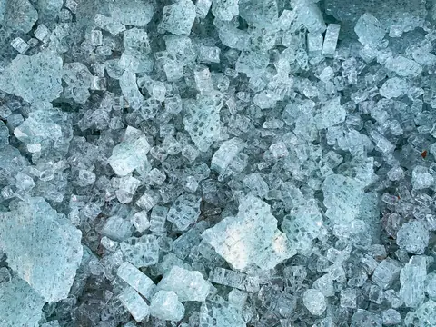 Pieces of a shattered tempered car window